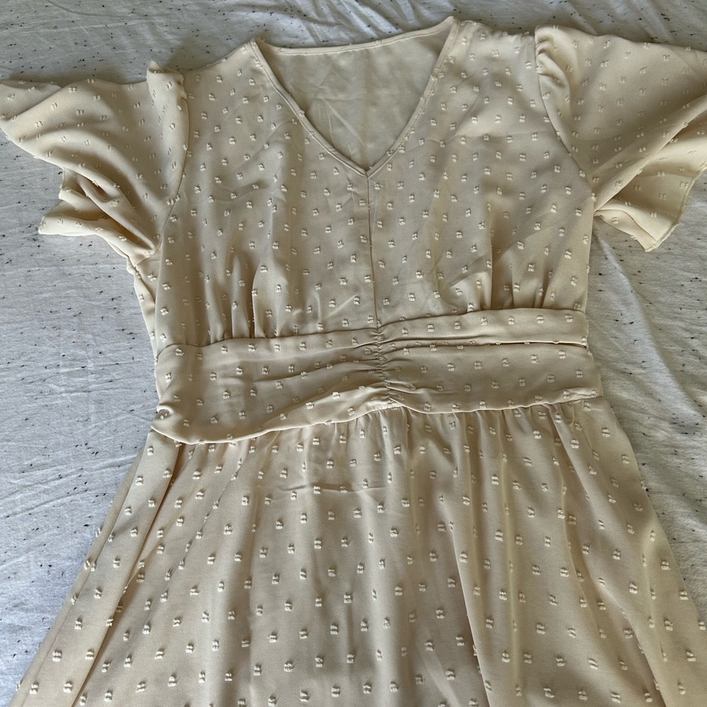 Elegant Cream Dress with Textured Pattern